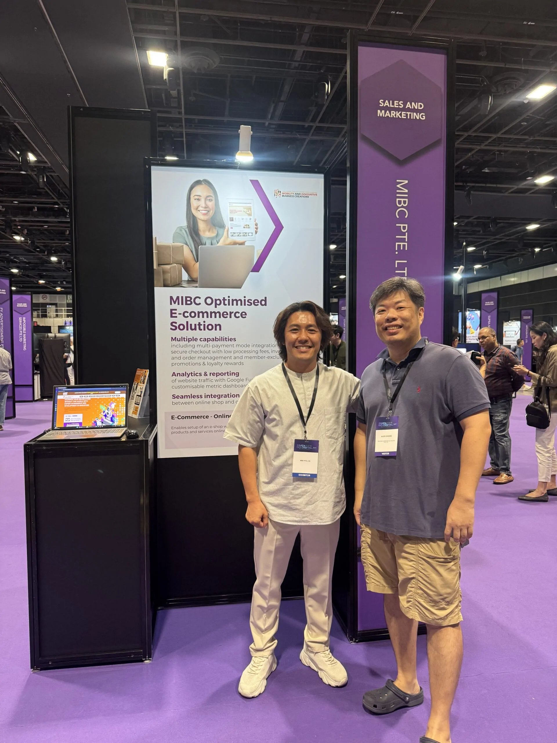 MIBC team member with a visitor at the SMEs Go Digital Day 2025 booth