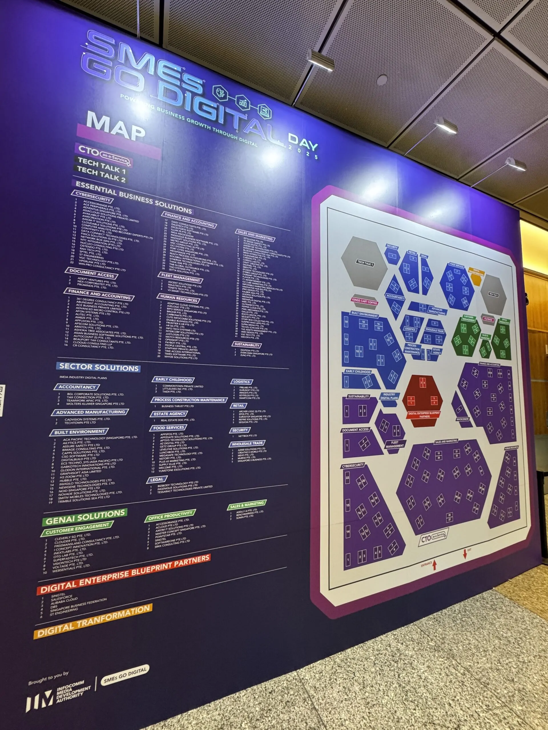 Two MIBC team members at the SMEs Go Digital Day 2025 booth