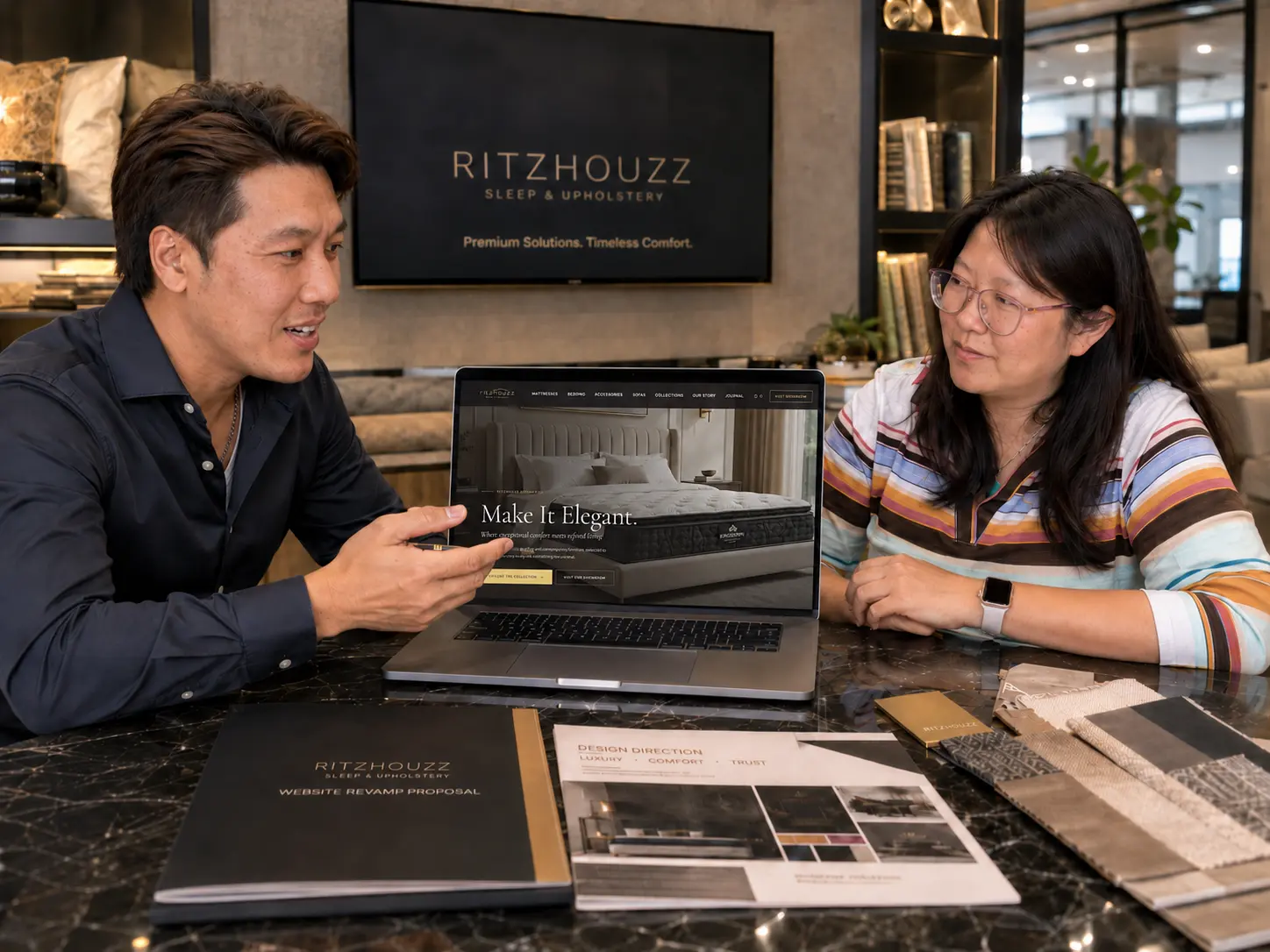 RitzHouzz and MIBC team reviewing the website revamp on a laptop